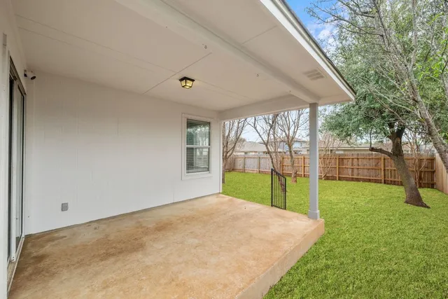 a view of a backyard with a swimming pool