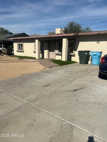a front view of a house with parking space