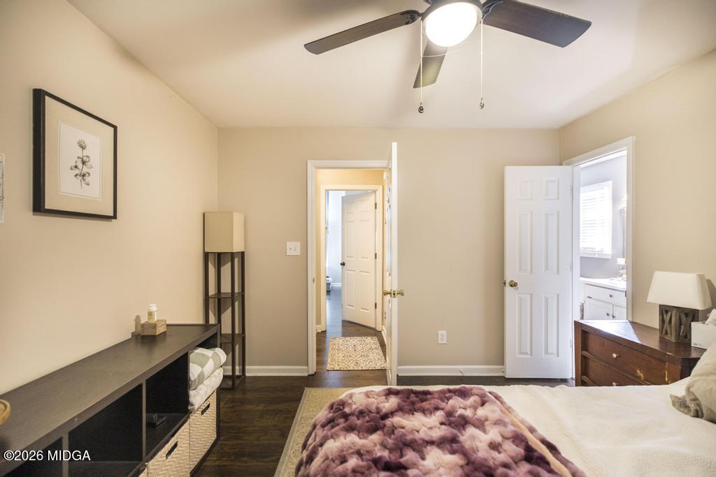 128 Springwood Court Macon, GA 31210 - Photo 15 of 21 a bedroom with a bed and a chandelier