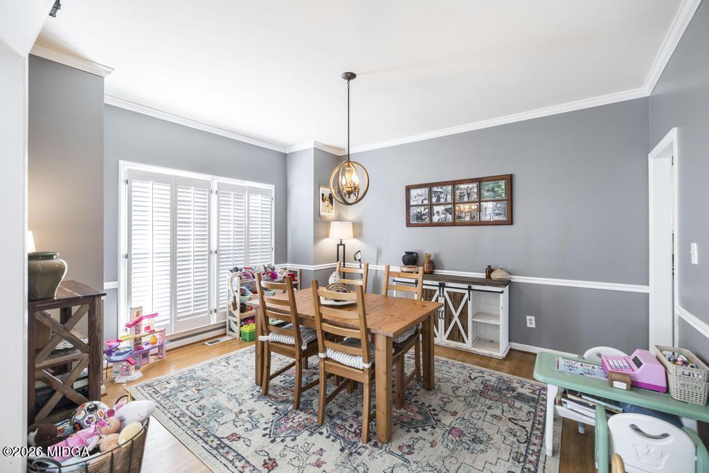 128 Springwood Court Macon, GA 31210 - Photo 7 of 21 a view of a dining room with furniture window and wooden floor