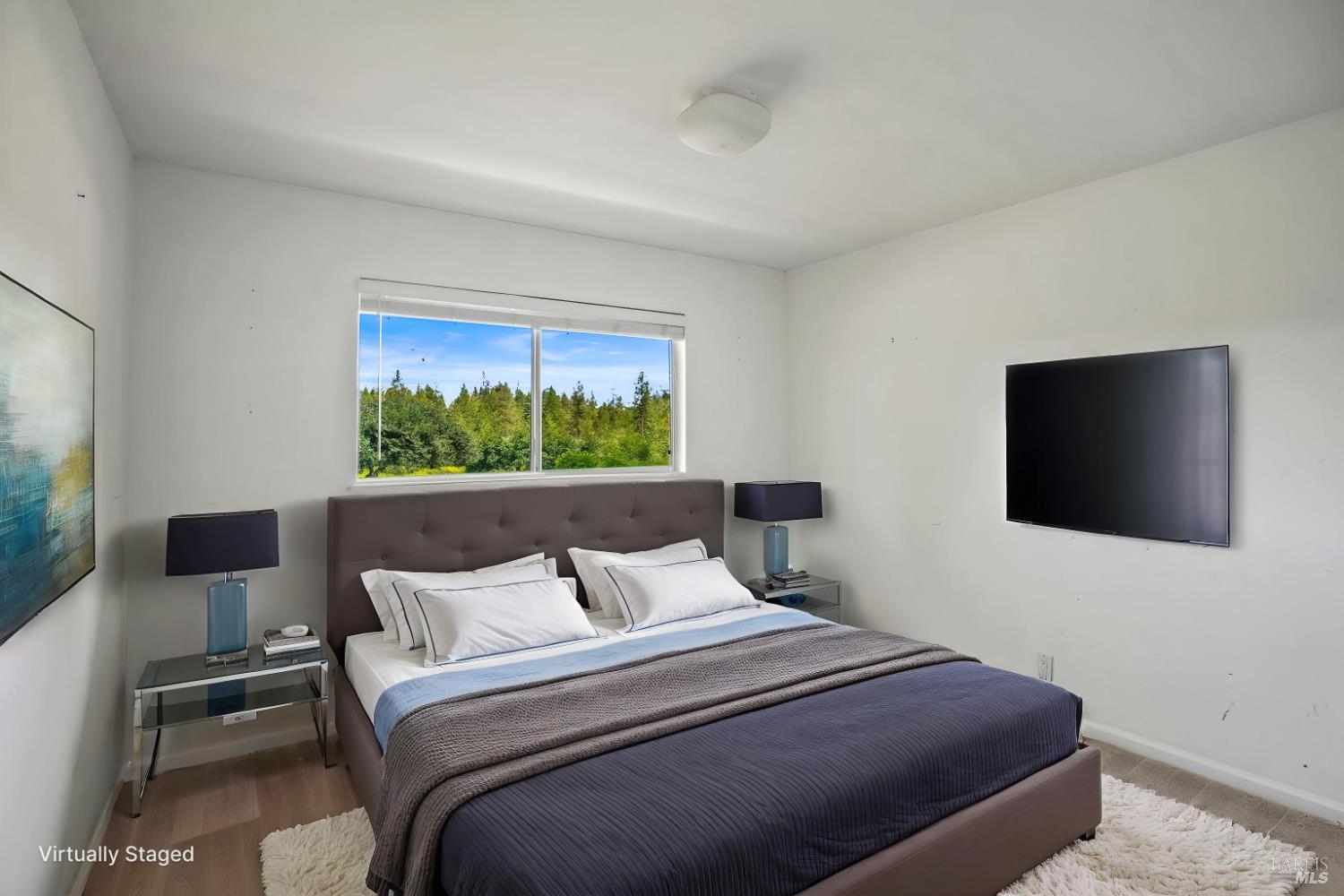 625-629 Hill Road Angwin, CA 94508 - Photo 21 of 64 a bedroom with a bed and a flat screen tv