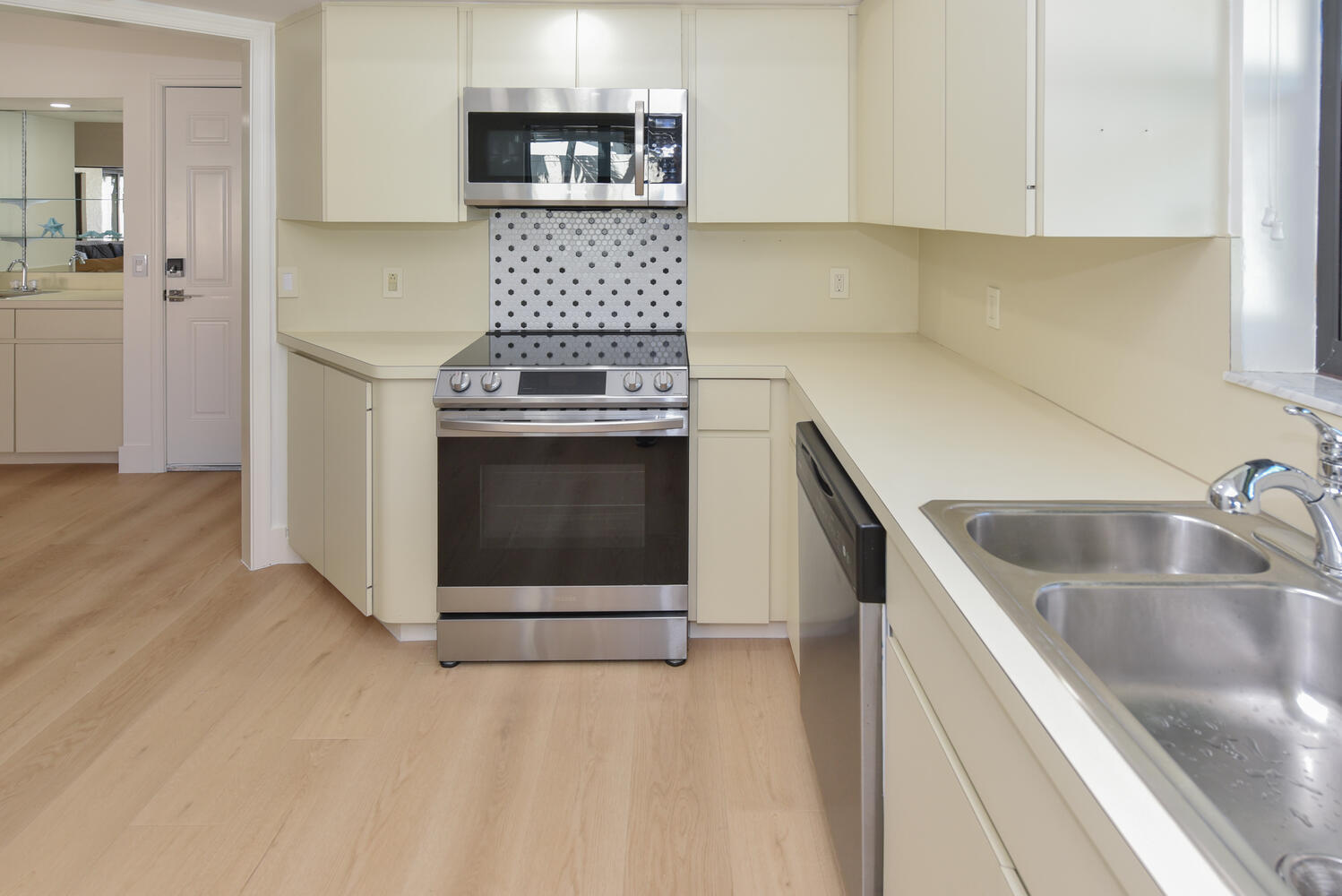 1469 Vía Privada Jupiter, FL 33477 - Photo 18 of 38 a kitchen with stainless steel appliances granite countertop a stove and a sink