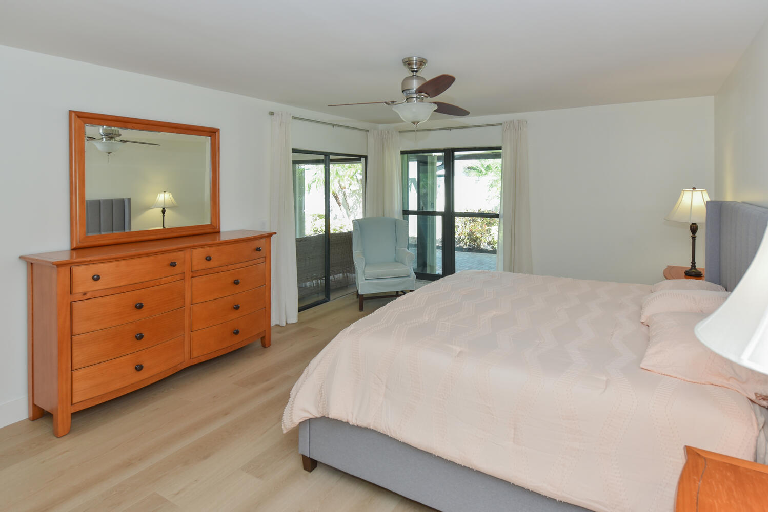 1469 Vía Privada Jupiter, FL 33477 - Photo 22 of 38 a bedroom with a large bed and a dresser