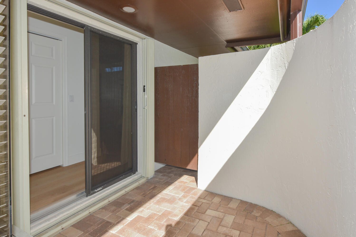 1469 Vía Privada Jupiter, FL 33477 - Photo 25 of 38 a view of a big room with wooden floor and windows