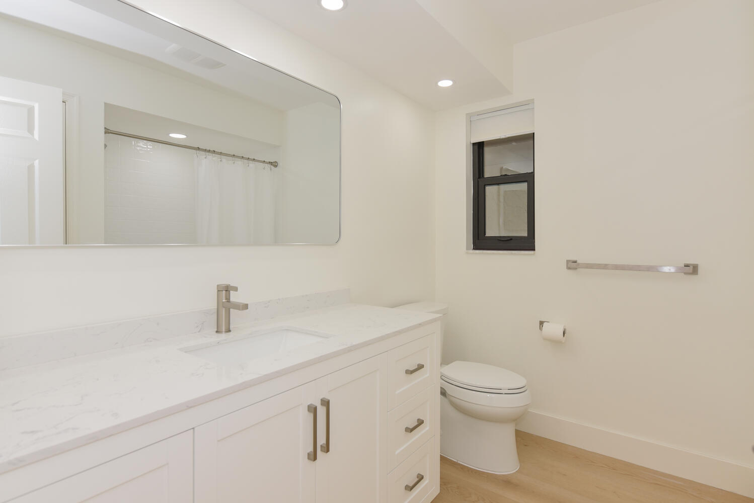 1469 Vía Privada Jupiter, FL 33477 - Photo 28 of 38 a bathroom with a sink a toilet and a mirror