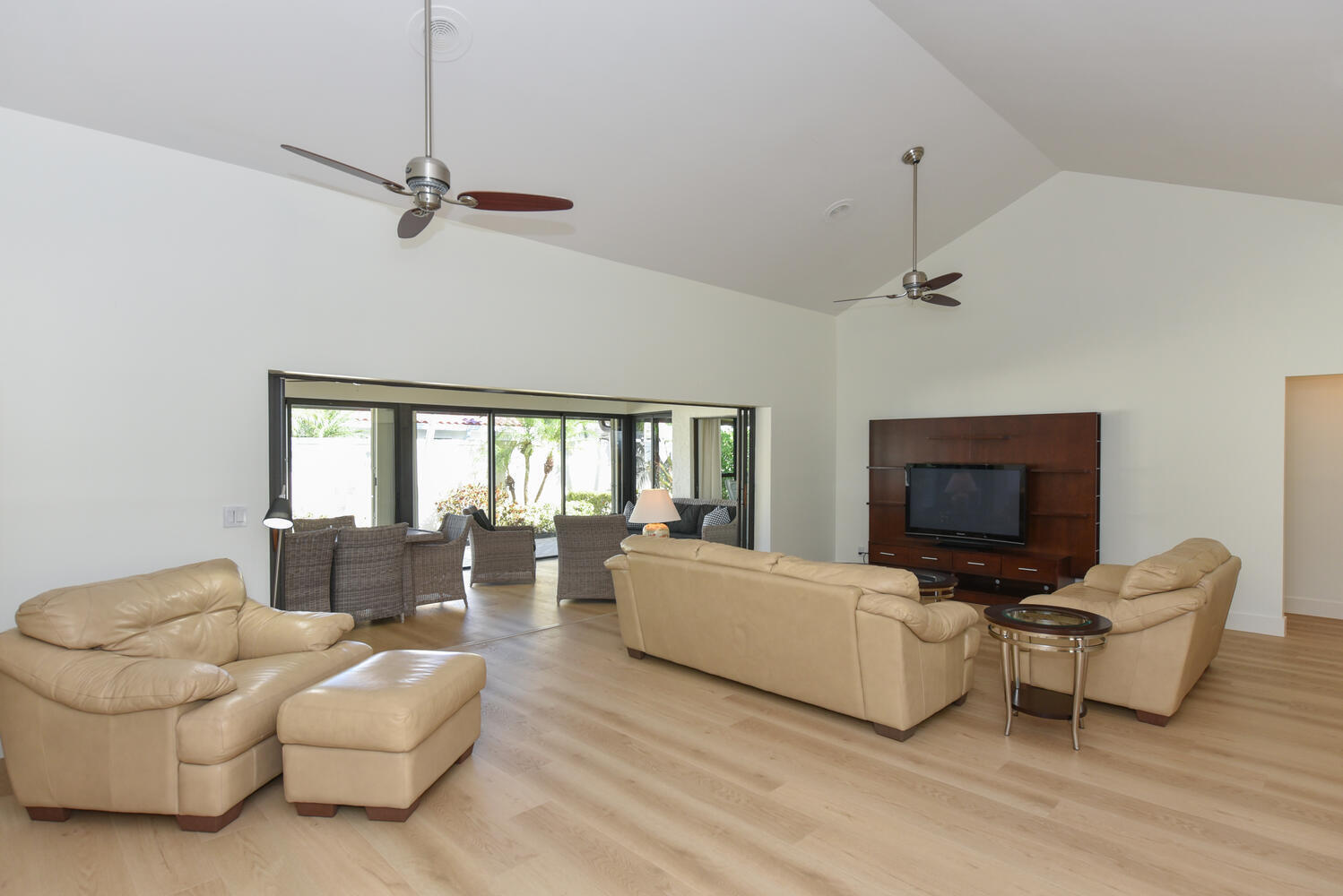 1469 Vía Privada Jupiter, FL 33477 - Photo 7 of 38 a living room with furniture fireplace and a flat screen tv