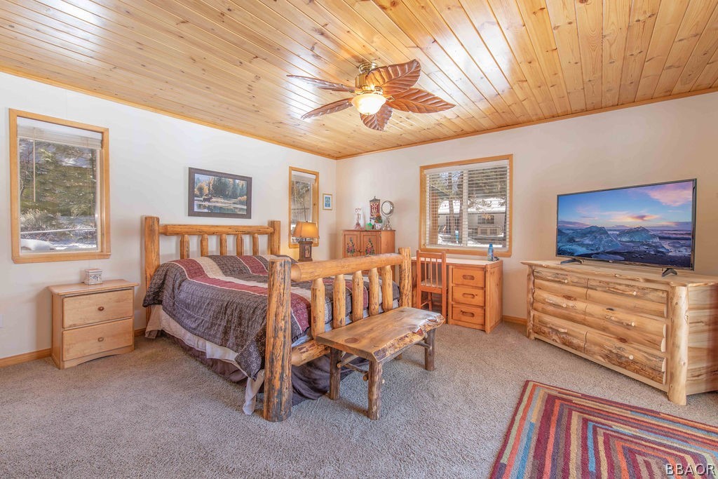 43132 Moonridge Road Big Bear Lake, CA 92315 - Photo 20 of 41 a bedroom with furniture and a chandelier