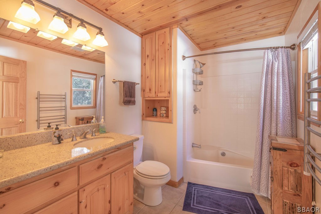 43132 Moonridge Road Big Bear Lake, CA 92315 - Photo 23 of 41 a bathroom with a granite countertop sink toilet and shower