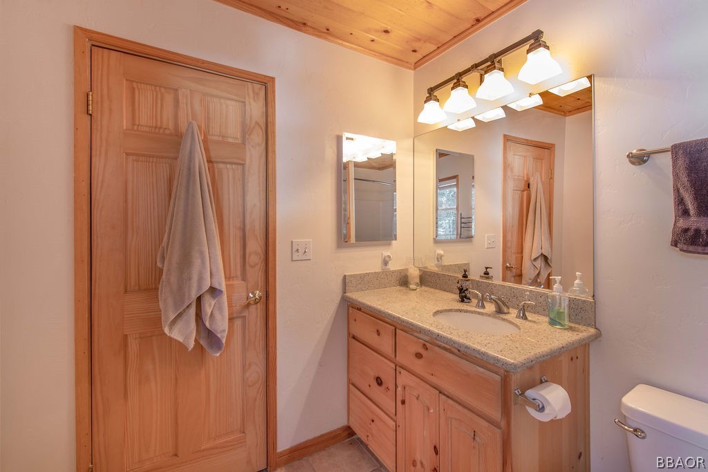 43132 Moonridge Road Big Bear Lake, CA 92315 - Photo 24 of 41 a bathroom with a double vanity sink mirror and double