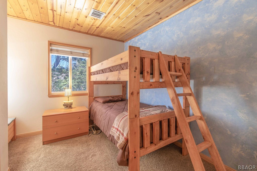 43132 Moonridge Road Big Bear Lake, CA 92315 - Photo 25 of 41 a bedroom with a bed and a window