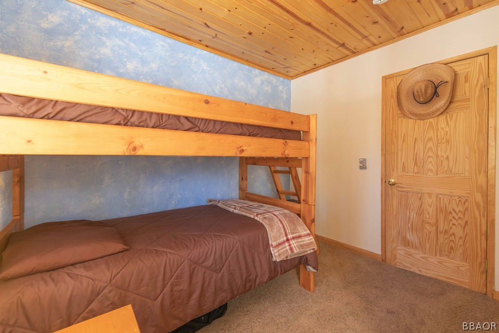 43132 Moonridge Road Big Bear Lake, CA 92315 - Photo 26 of 41 a bedroom with a bed and a window