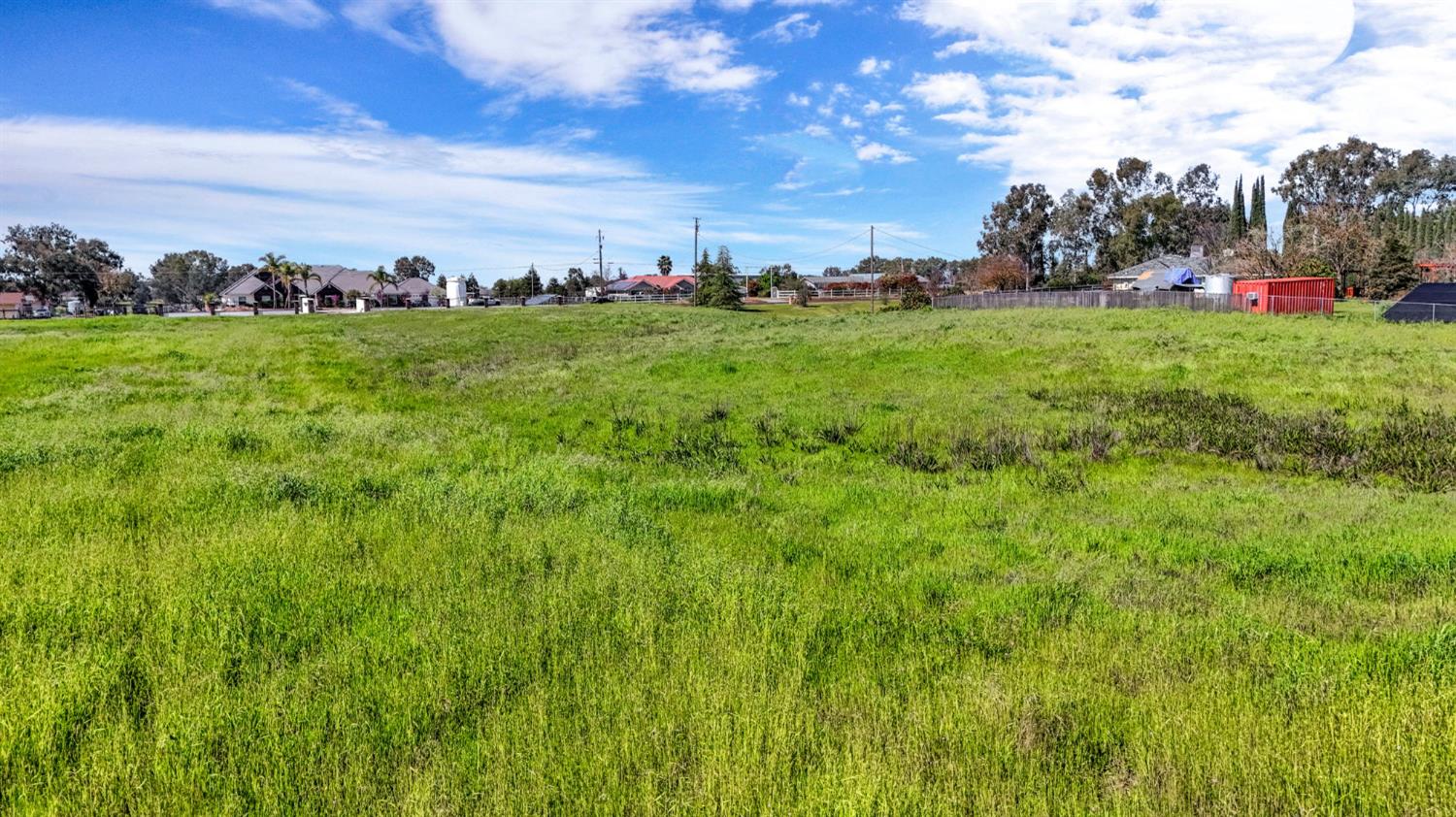 9999 Anaconda Road Madera, CA 93636 - Photo 17 of 20 a view of a golf course with a lake
