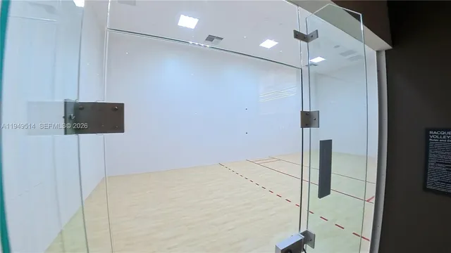 a bathroom with a shower and a sink