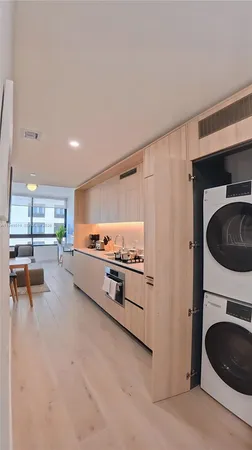 a kitchen with stainless steel appliances a stove a microwave and a refrigerator