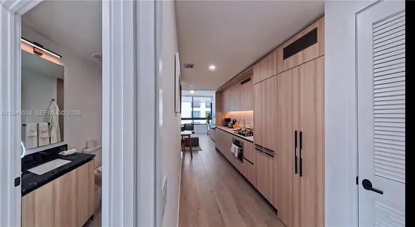 a view of a kitchen from a hallway