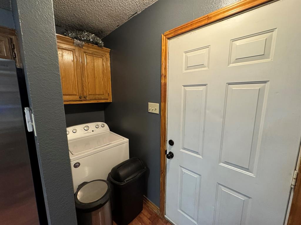 705 East James Street Wills Point, TX 75169 - Photo 21 of 26 a bathroom with a toilet and a shower