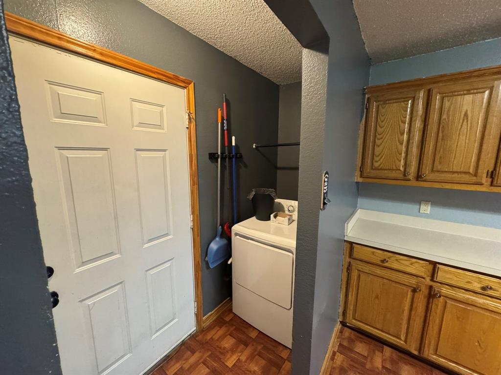 705 East James Street Wills Point, TX 75169 - Photo 25 of 26 a utility room with a sink a washer and dryer next to a window