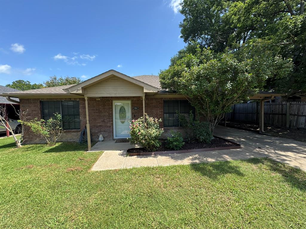 705 East James Street Wills Point, TX 75169 - Photo 26 of 26 a front view of a house with a yard and porch