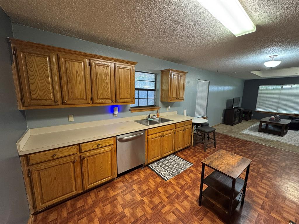 705 East James Street Wills Point, TX 75169 - Photo 4 of 26 a kitchen with a sink cabinets and window