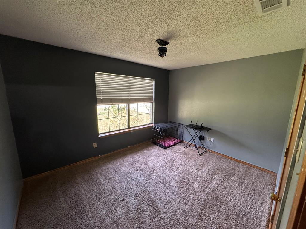 705 East James Street Wills Point, TX 75169 - Photo 8 of 26 a view of a room with a window