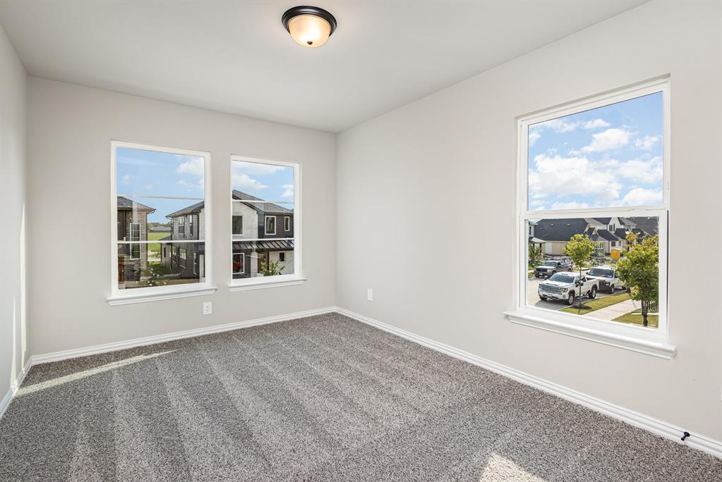 7221 Bayhill Drive Rowlett, TX 75088 - Photo 13 of 18 Empty room with baseboards and carpet flooring