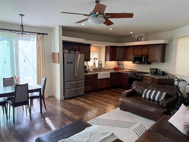 a kitchen with granite countertop lots of counter top space and appliances