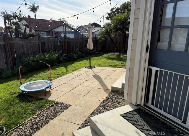 a view of a backyard with sitting area