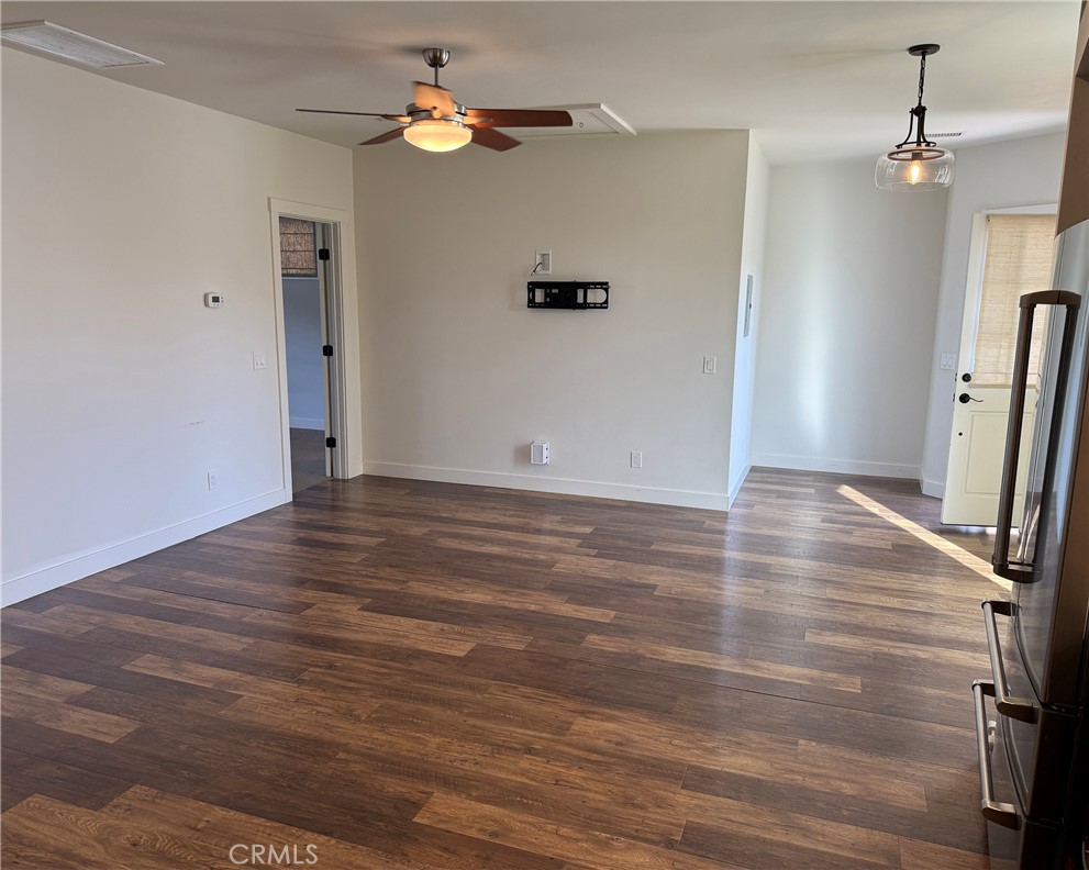 25955 Via Del Rey, Unit B San Juan Capistrano, CA 92675 - Photo 6 of 20 wooden floor in an empty room with a window