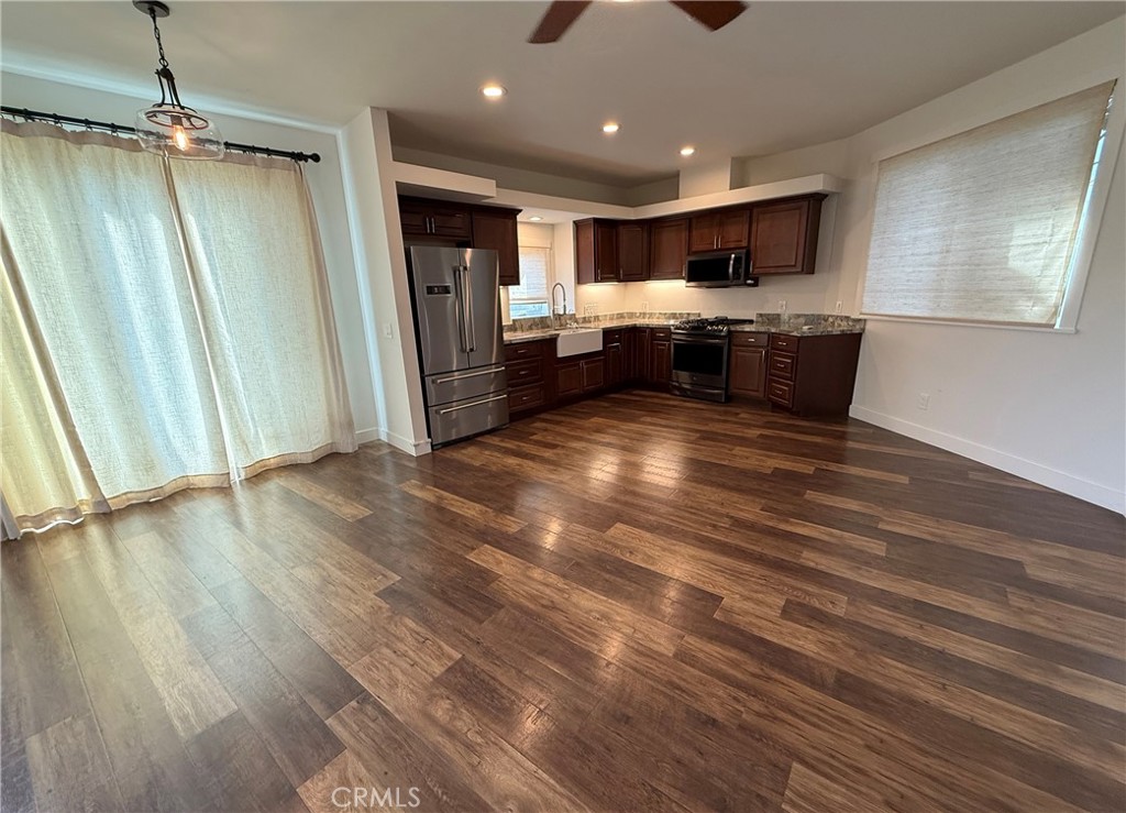25955 Via Del Rey, Unit B San Juan Capistrano, CA 92675 - Photo 8 of 20 a view of kitchen with sink and wooden floor