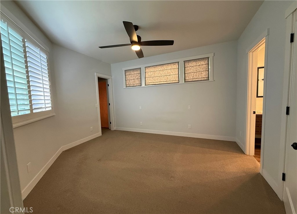 25955 Via Del Rey, Unit B San Juan Capistrano, CA 92675 - Photo 10 of 20 an empty room with windows and fan