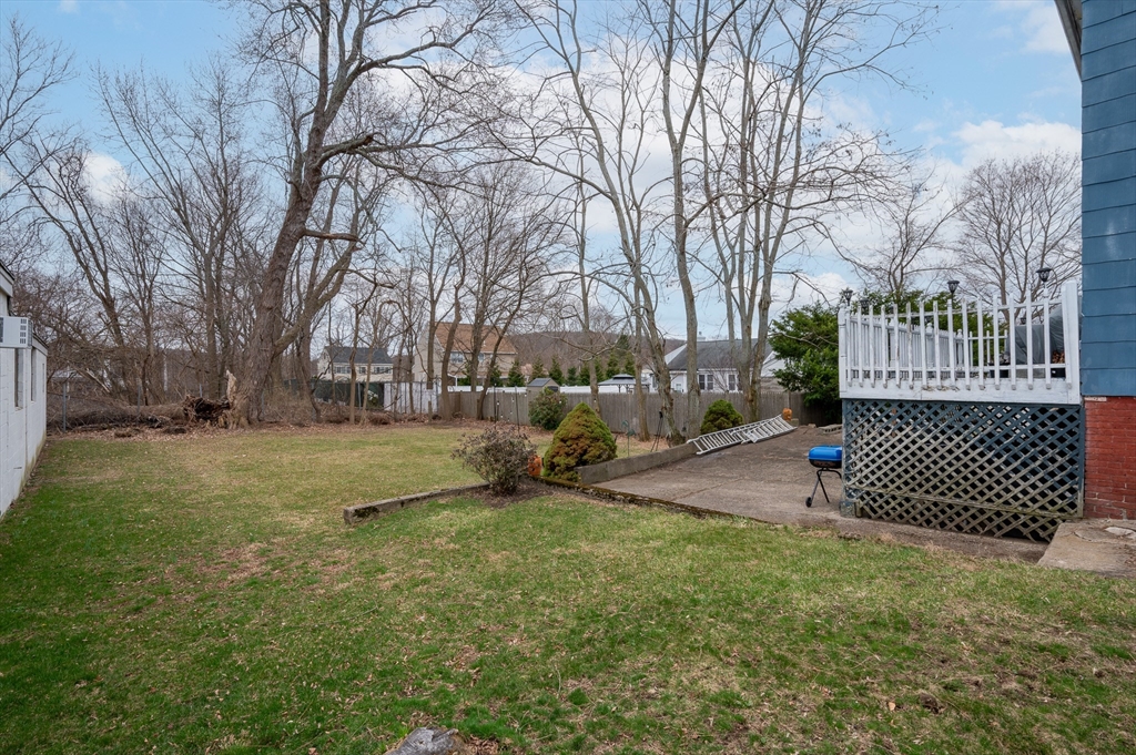 512 River Street Haverhill, MA 01832 - Photo 3 of 7 a view of a yard with a house and trees