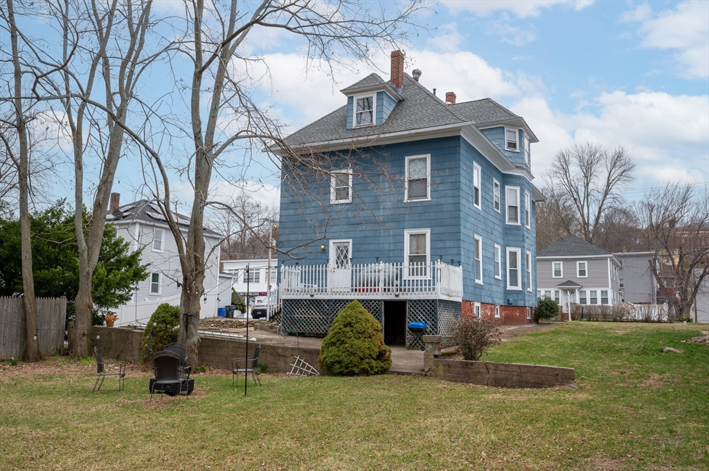 512 River Street Haverhill, MA 01832 - Photo 5 of 7 a front view of a house with a garden