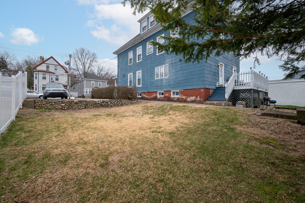 512 River Street Haverhill, MA 01832 - Photo 7 of 7 a view of a house with a yard