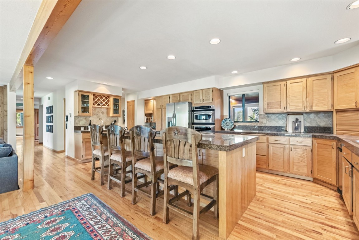 272 Penstemon Road Keystone, CO 80435 - Photo 12 of 50 a large white kitchen with lots of counter top space and stainless steel appliances