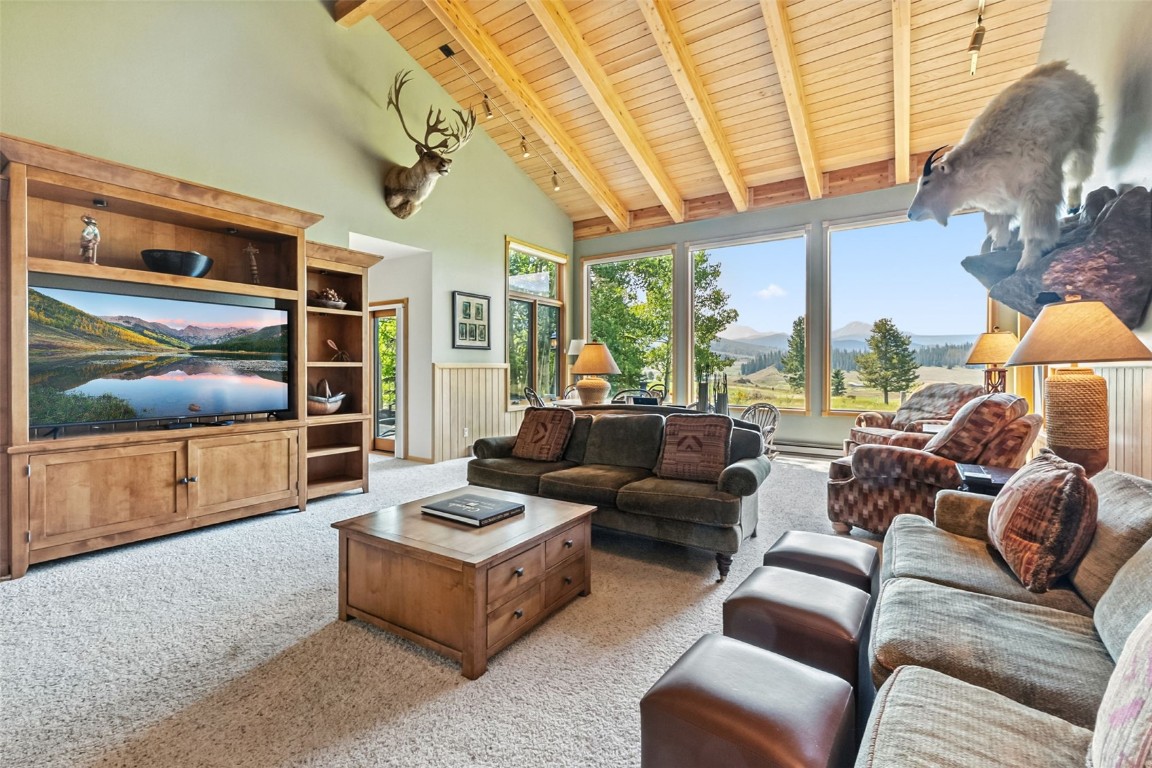 272 Penstemon Road Keystone, CO 80435 - Photo 2 of 50 a living room with furniture and a flat screen tv