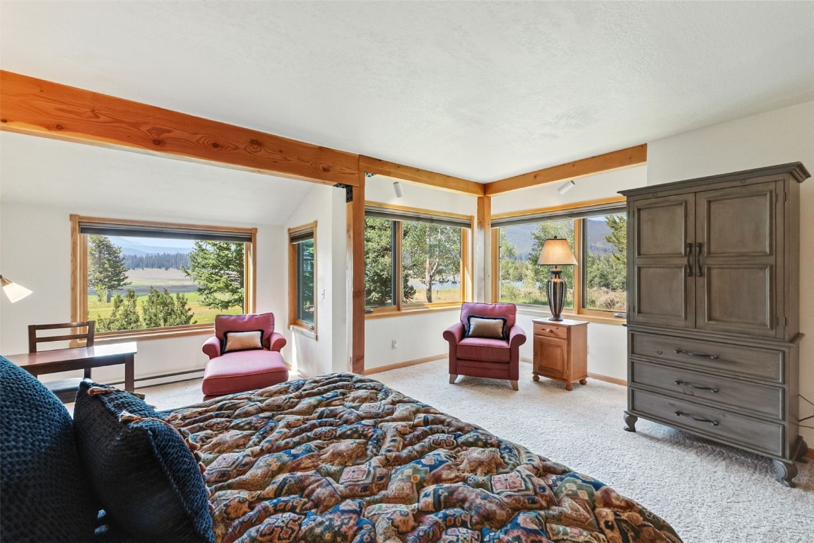 272 Penstemon Road Keystone, CO 80435 - Photo 23 of 50 a bedroom with a bed and wooden floor