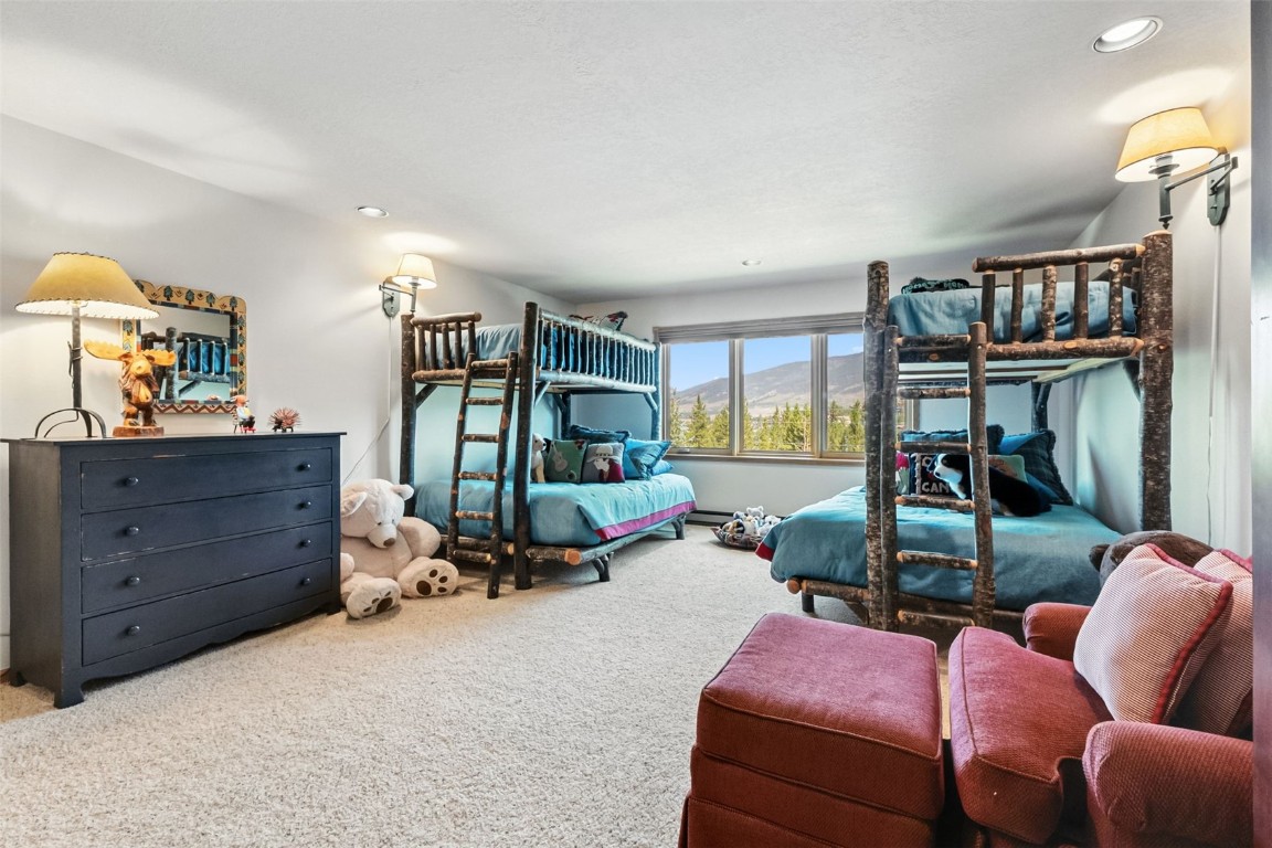 272 Penstemon Road Keystone, CO 80435 - Photo 27 of 50 a bedroom with furniture and a large window