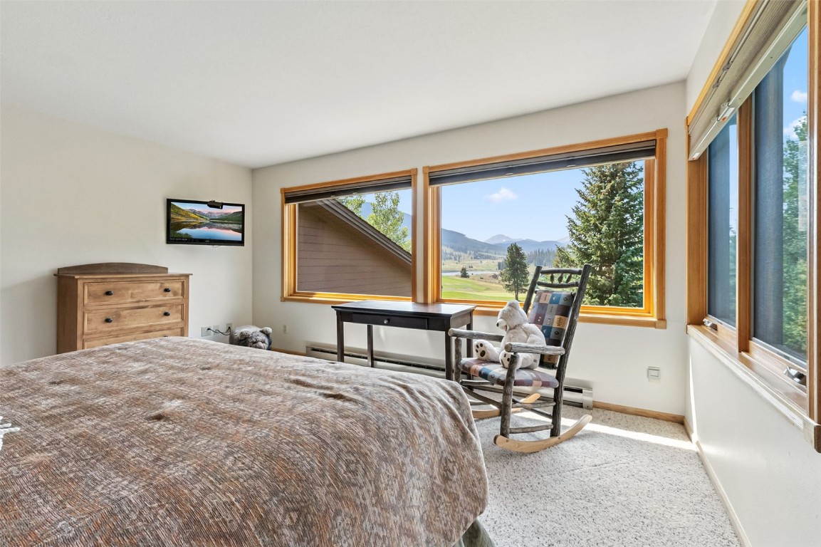 272 Penstemon Road Keystone, CO 80435 - Photo 31 of 50 a bedroom with a bed and large windows