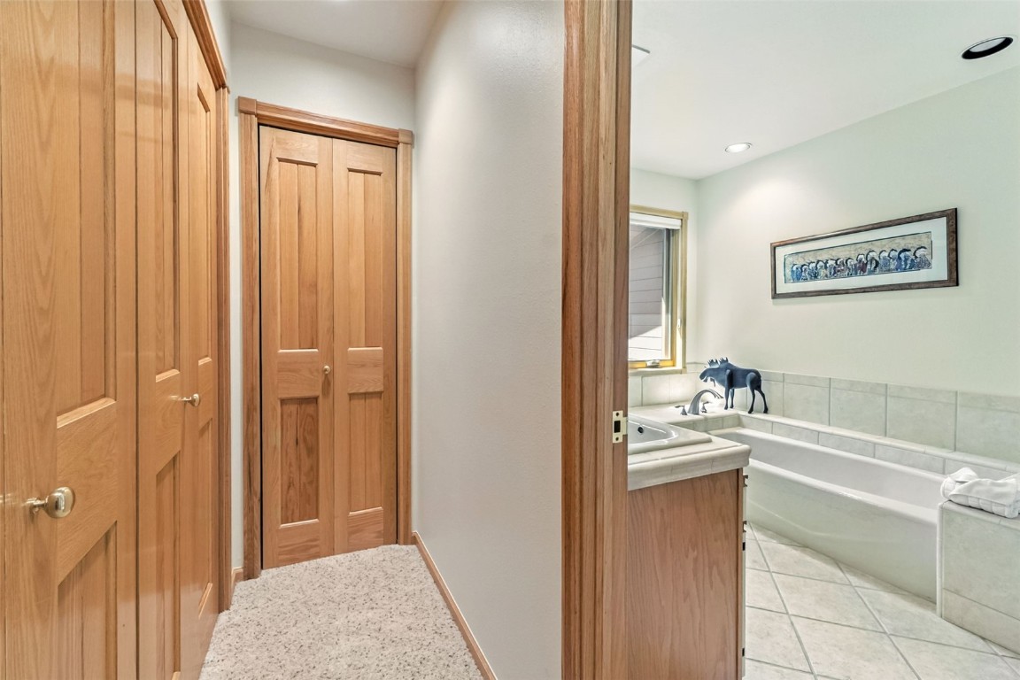 272 Penstemon Road Keystone, CO 80435 - Photo 36 of 50 a bathroom with a sink a mirror and a bathtub