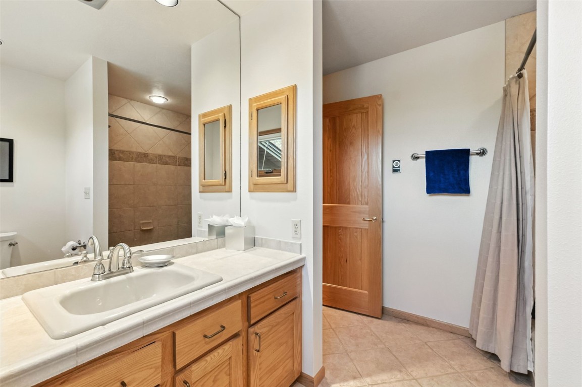 272 Penstemon Road Keystone, CO 80435 - Photo 41 of 50 a bathroom with a sink double vanity and a mirror