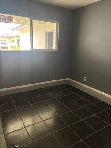 a bathroom with a window and a shower