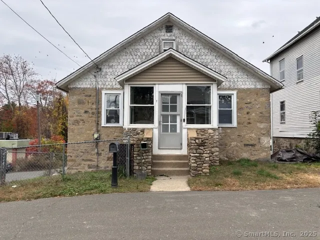 a front view of a house with garage