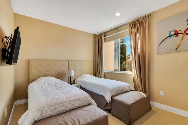 a bedroom with furniture and a window