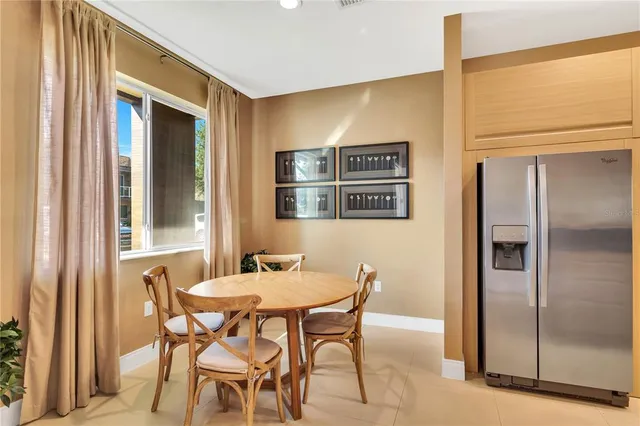 a dining room with furniture and window