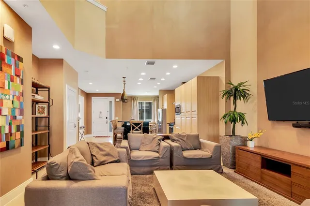 a living room with fireplace furniture and a flat screen tv