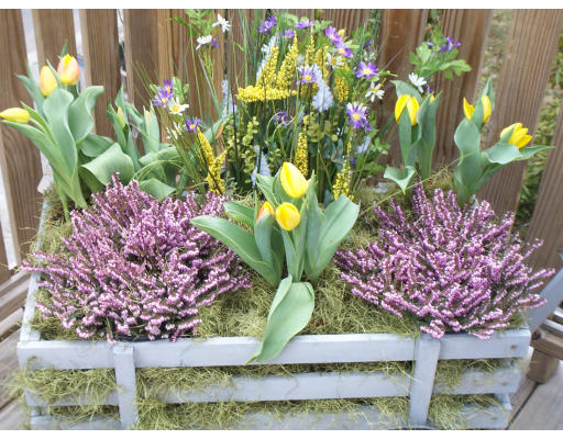 67 Green Street, Unit B Marblehead, MA 01945 - Photo 11 of 11 a vase of flowers are sitting in a garden