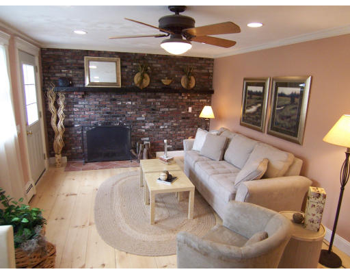 67 Green Street, Unit B Marblehead, MA 01945 - Photo 4 of 11 a living room with furniture and a fireplace