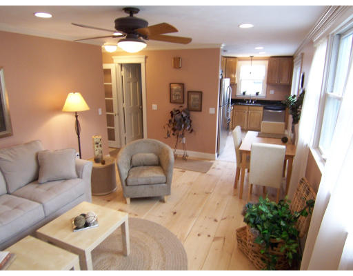 67 Green Street, Unit B Marblehead, MA 01945 - Photo 5 of 11 a living room with furniture and a chandelier