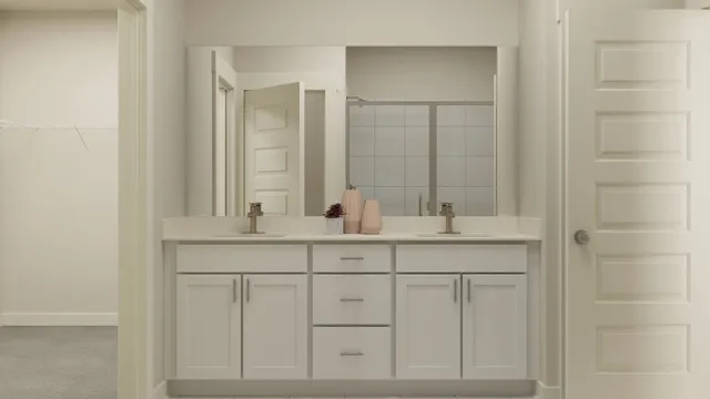 a bathroom with double sink and a mirror