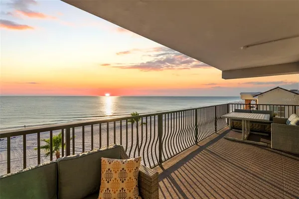 a view of a balcony with wooden floor